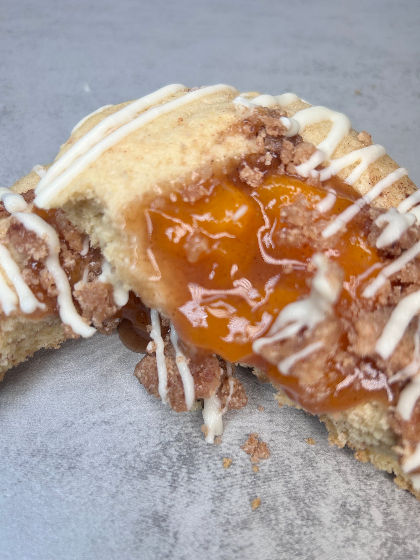 Peach cobbler cookie with white chocolate drizzle