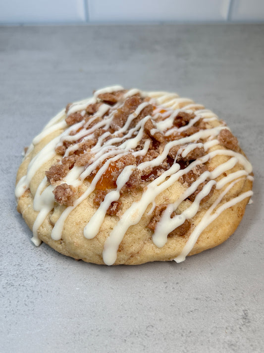 Peach cobbler cookie with white chocolate drizzle